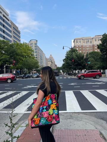 Jacqueline Aguilar crossing a street in DC.